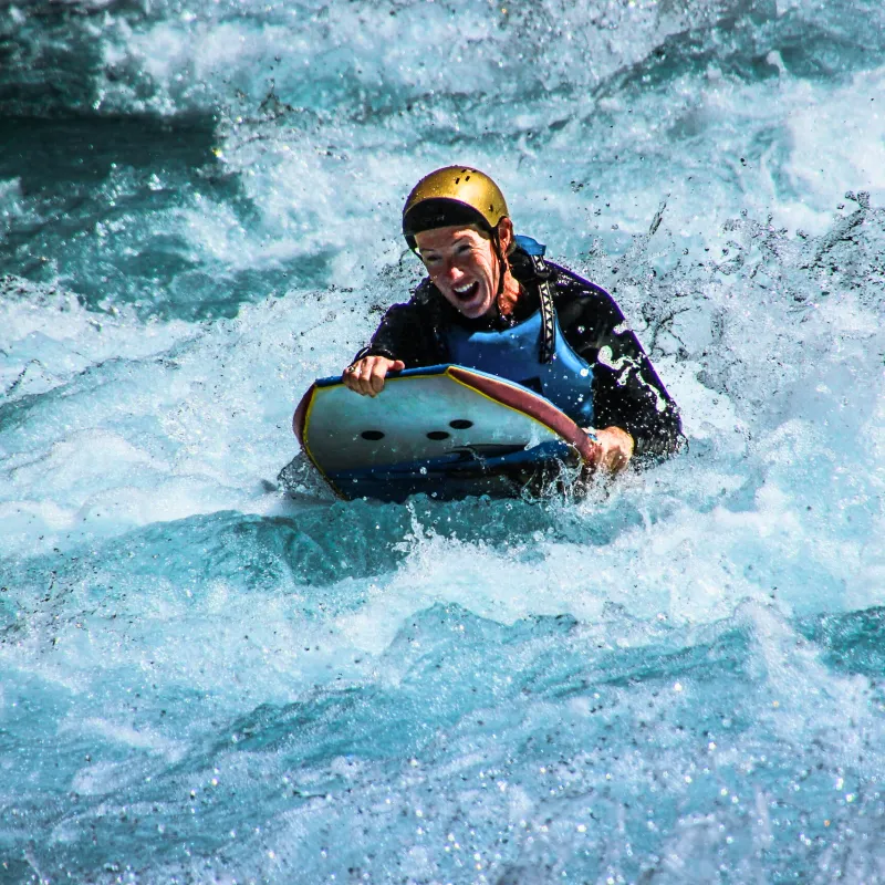 a man riding a wave on a surfboard in the water