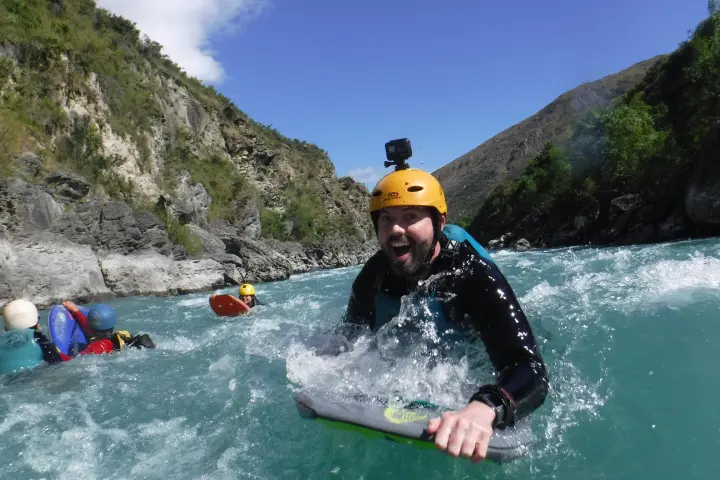 a person riding a surf board on a body of water