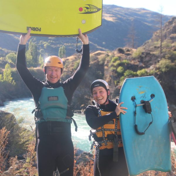 a man standing in front of a mountain