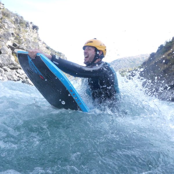 a man riding a wave on a surfboard in the water