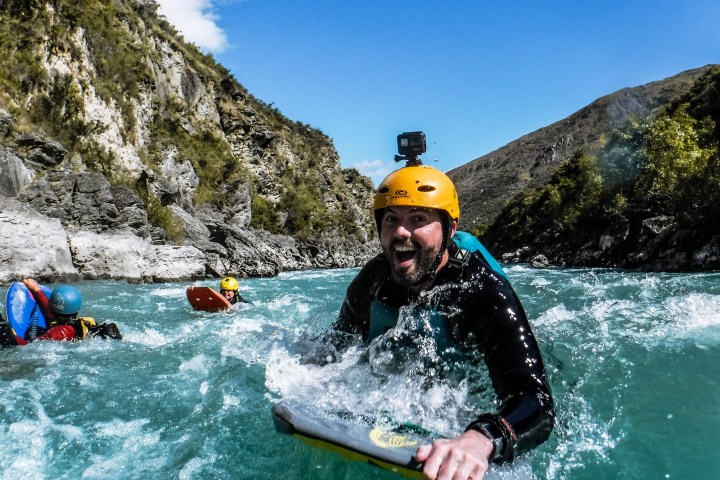 a person riding a surf board in the water