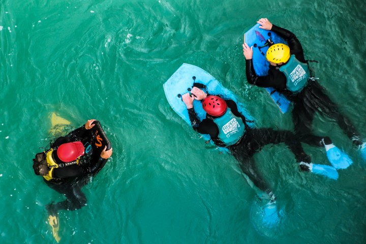 a train cake sitting on top of a swimming pool