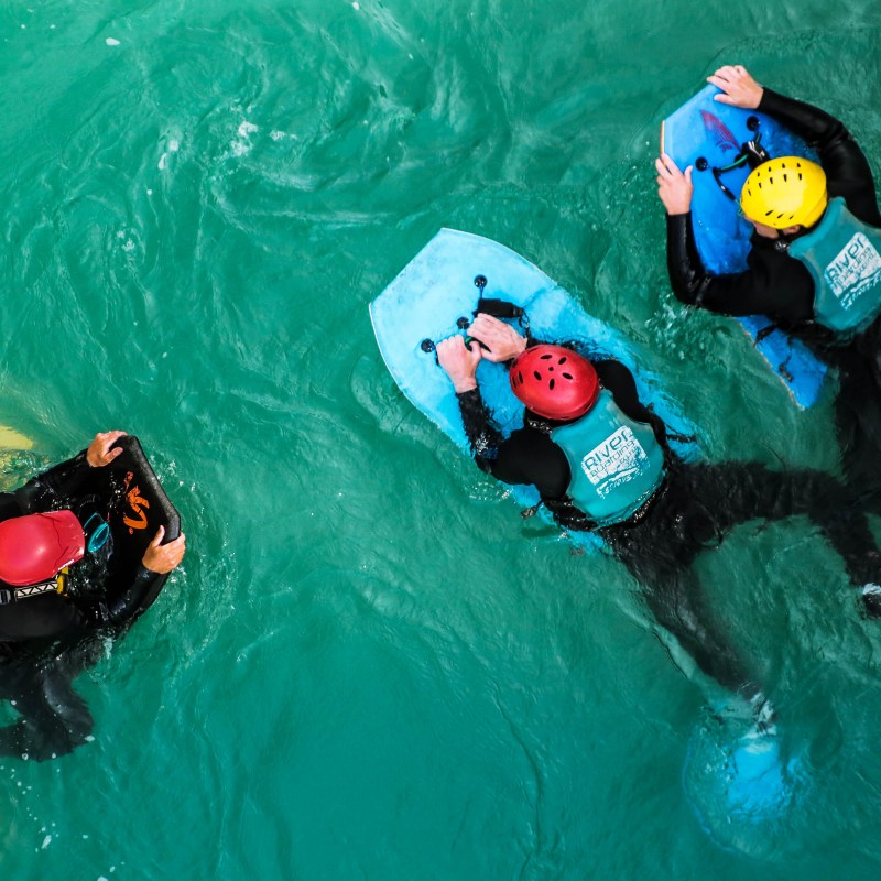 a train cake sitting on top of a swimming pool