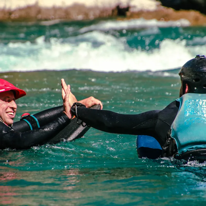 a child swimming in a body of water