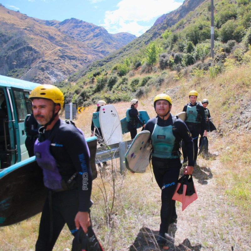 a group of people standing on top of a mountain