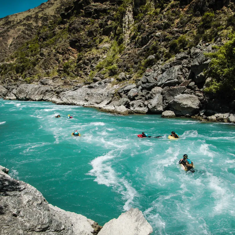 a man riding a wave on top of a mountain