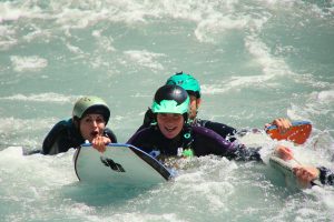 a person riding a surf board on a body of water