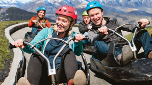a group of people sitting on top of a mountain