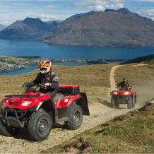 Queenstown-Quad-biking-Nomad-Quads-600×480 a truck is parked in front of a mountain