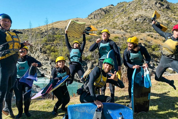 a group of people standing on top of a mountain