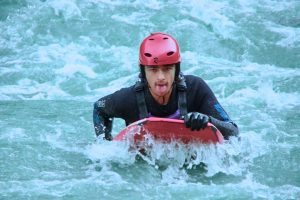 a person riding a surf board on a body of water