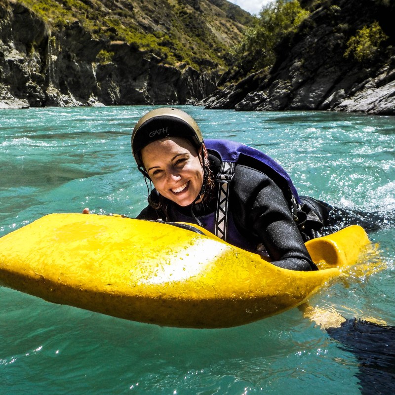 a person riding a surf board on a body of water